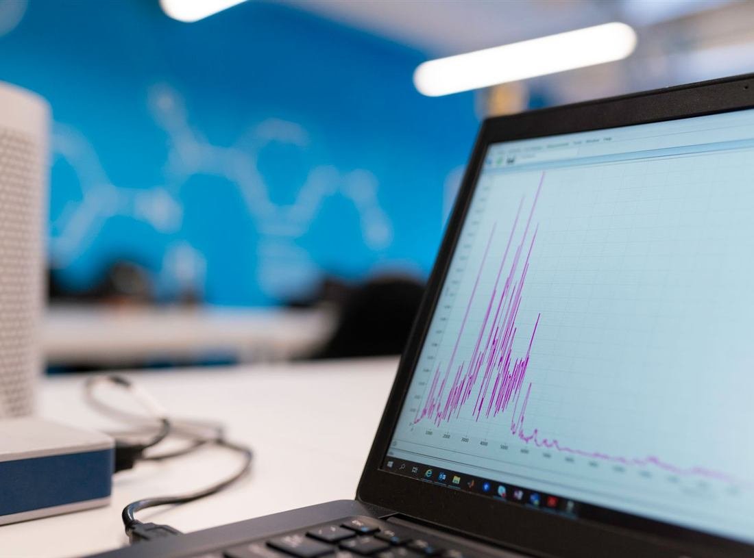 Laptop displaying a website analytics dashboard with growth charts